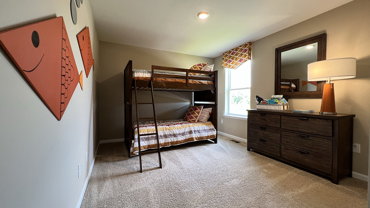 A secondary bedroom with one window.