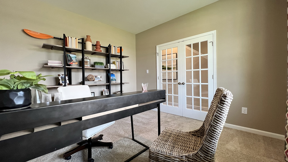 The flex room has glass French doors.