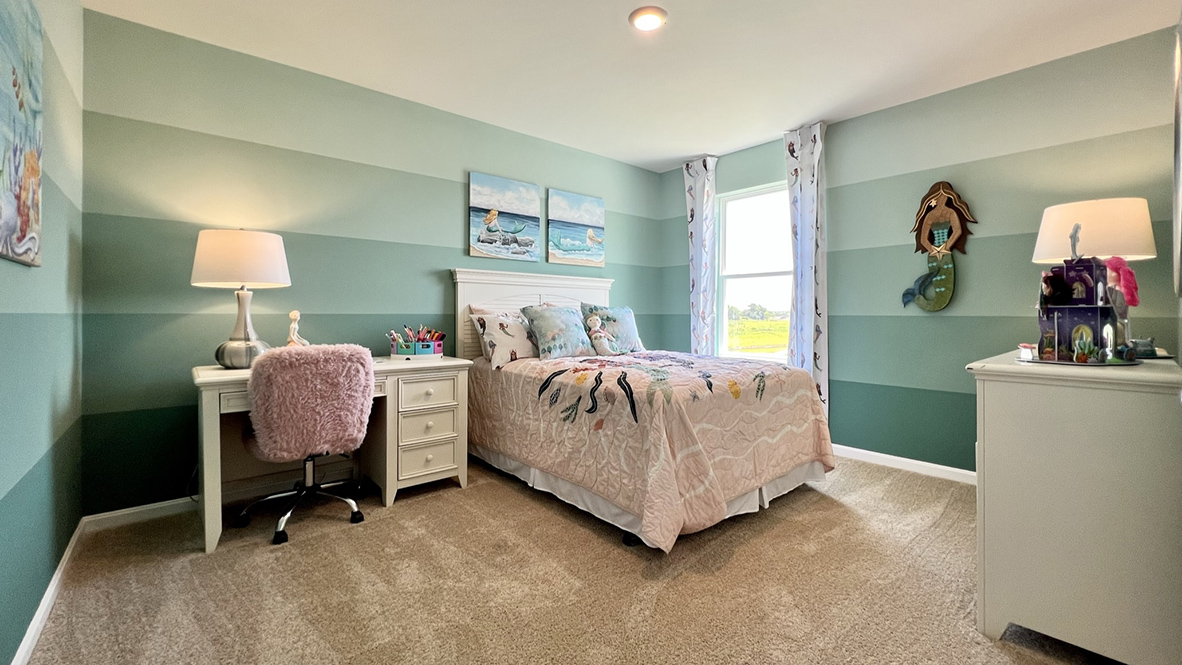 The fifth bedroom has plenty of natural light.