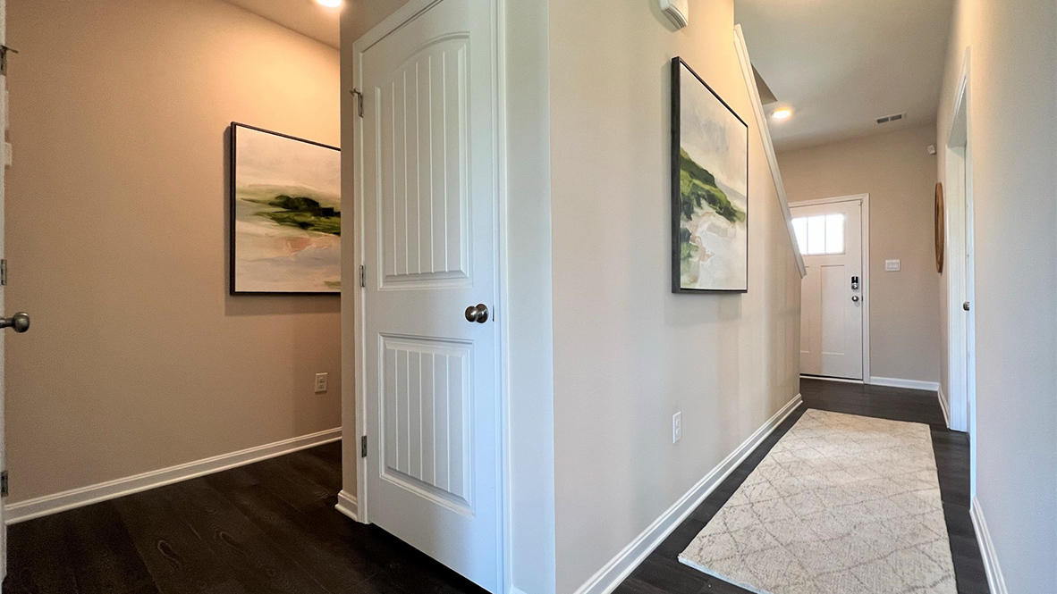 The two-car garage entrance is off of the foyer.