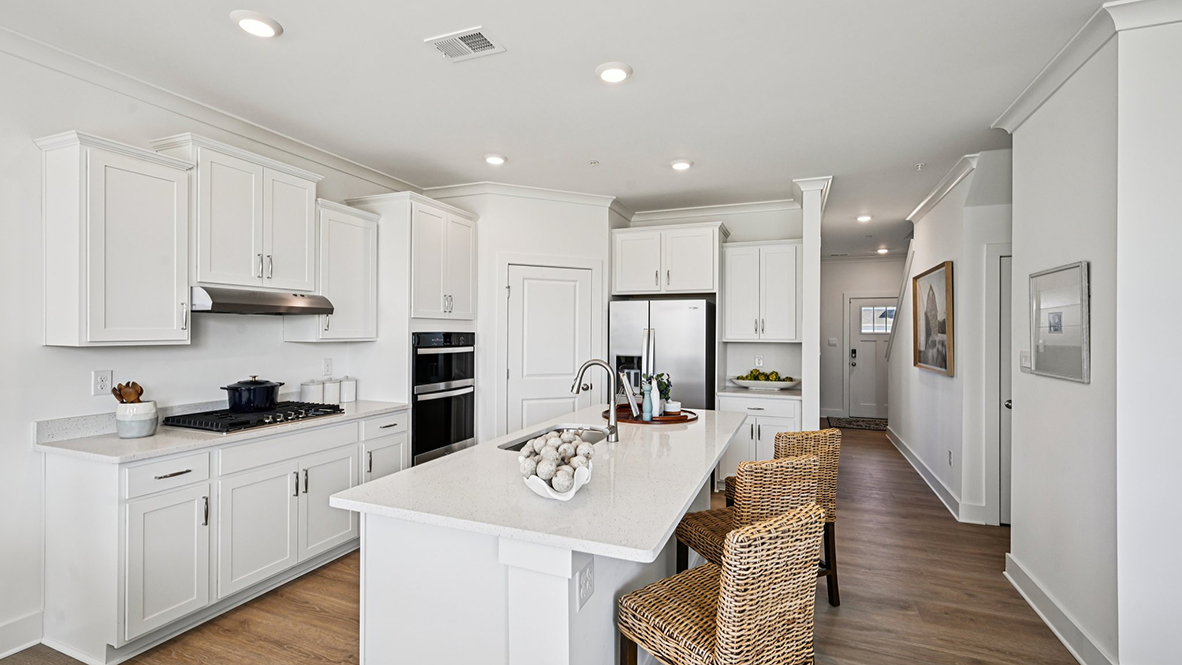The well-designed kitchen offers modern cabinetry.