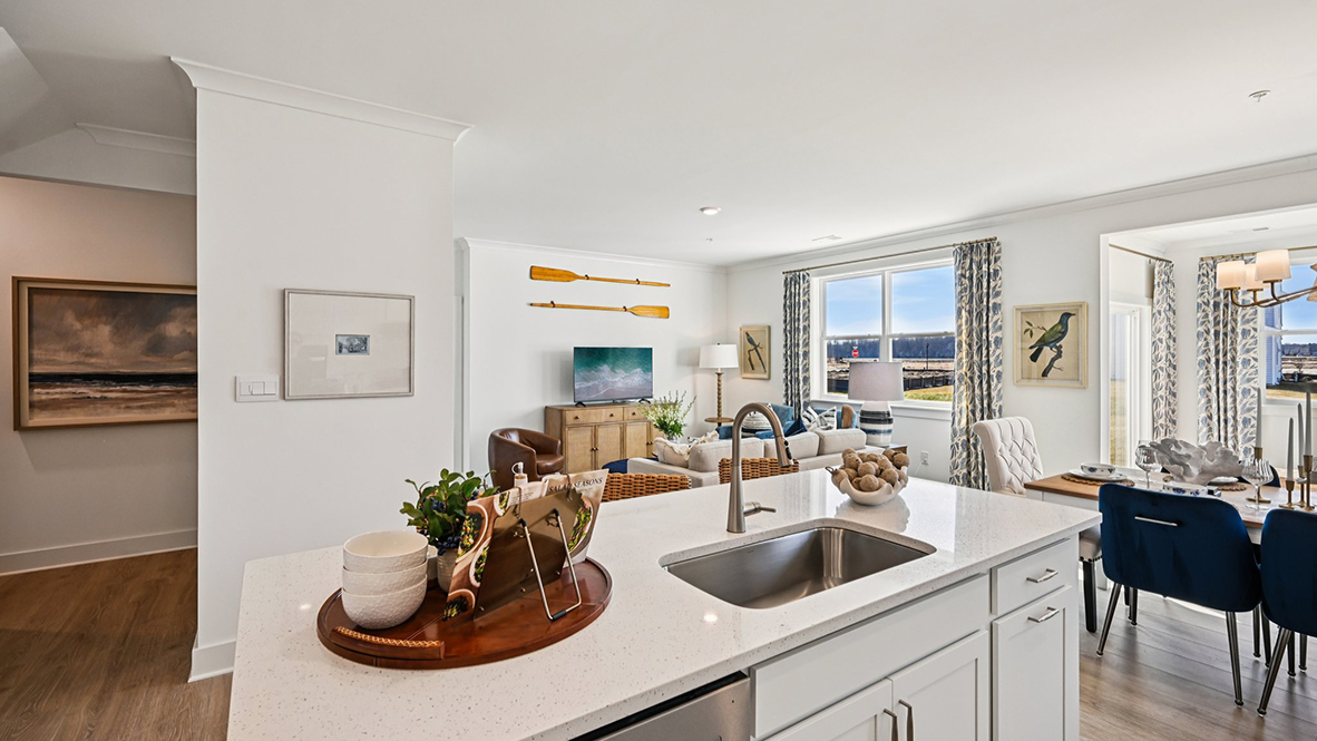 The large kitchen island has a built-in sink.
