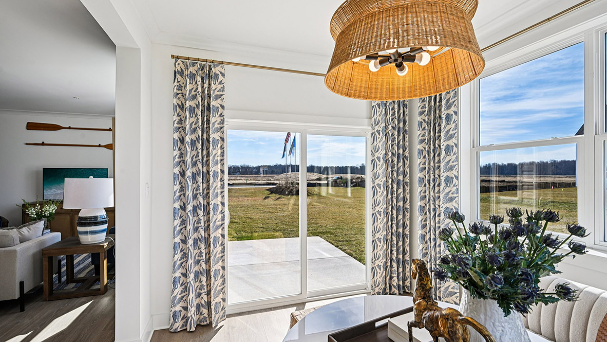 The sunroom leads you outside through the sliding glass doors.