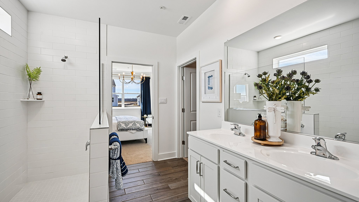 The primary bathroom has a double bowl vanity.