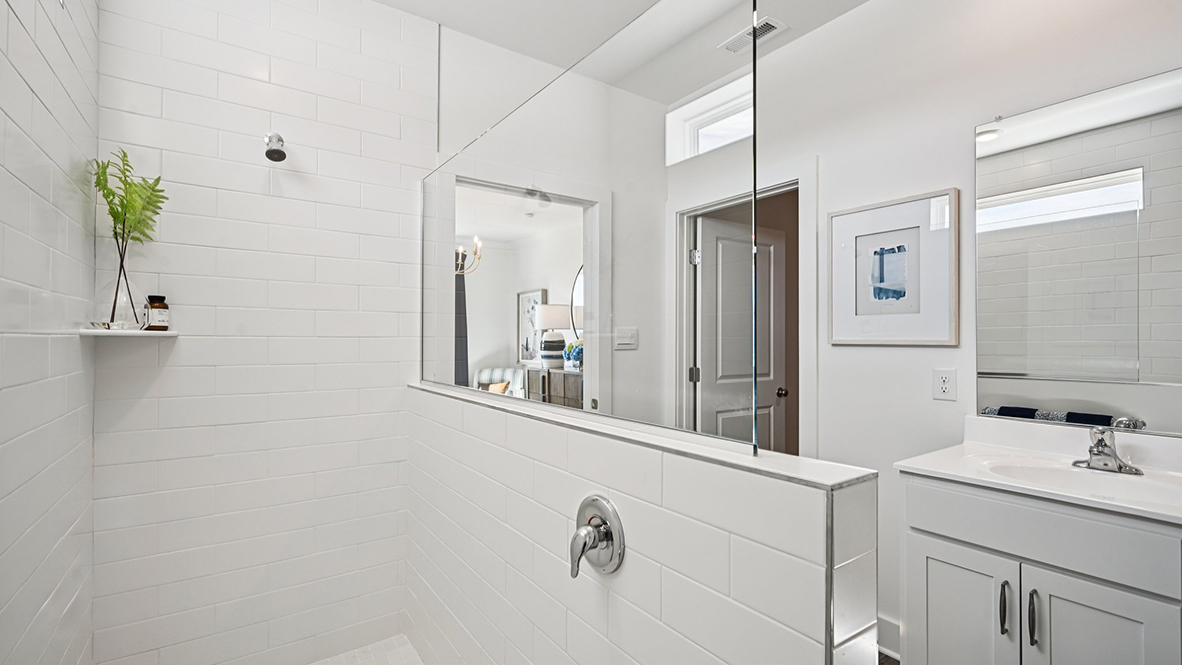 The primary bathroom has a large walk-in shower.