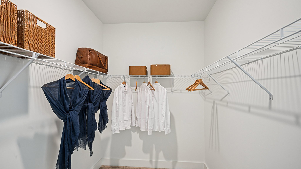 A large walk-in closet is inside the primary bathroom.