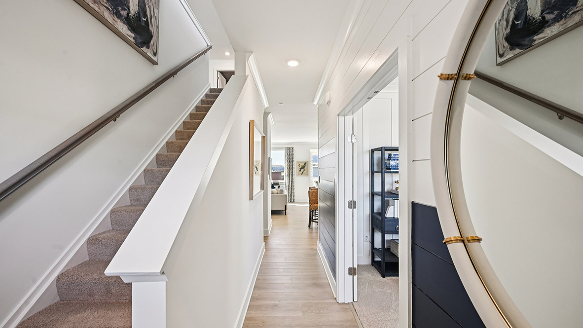 The foyer leads you past the stairway.