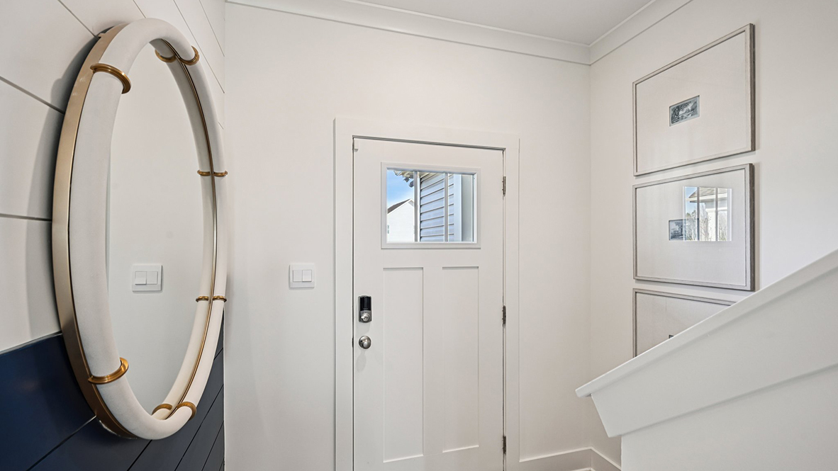 The foyer leads you past the stairway.