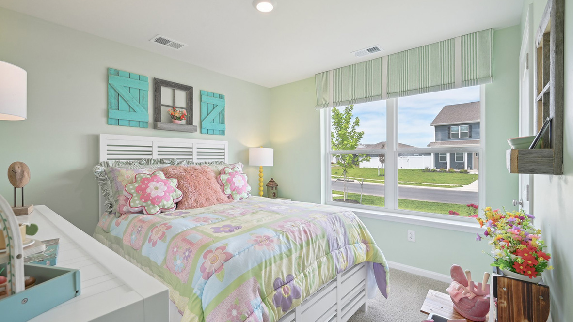 One guest bedroom has a large double window.