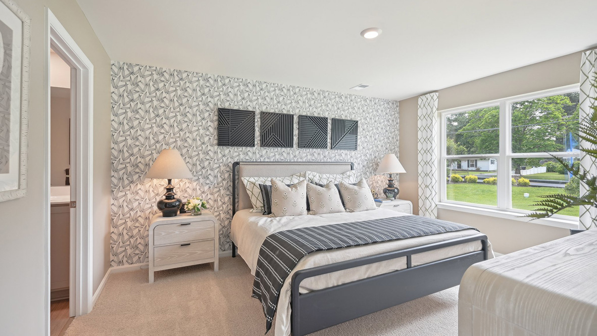 The primary bedroom has a large double window.