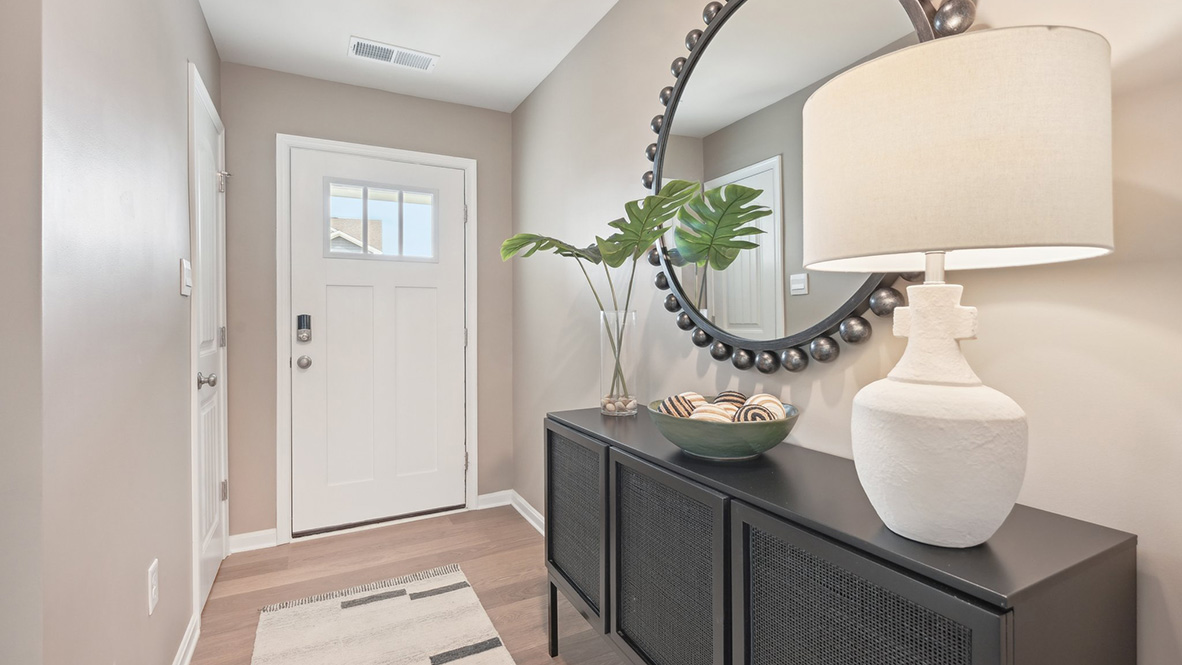 A coat closet greets you in the entrance way.