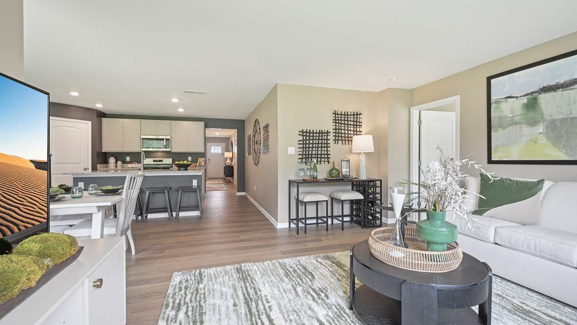 The open-concept floorplan connects the living, dining and kitchen.