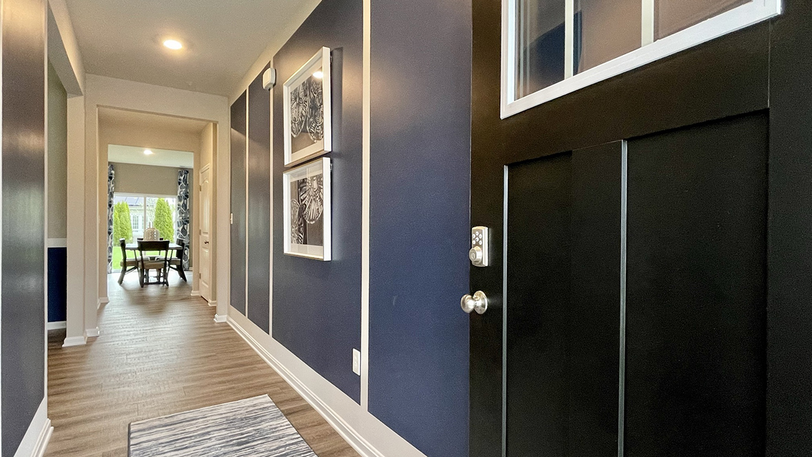 As you step into the distinct foyer you will appreciate an additional room that provides the perfect space for a home office.