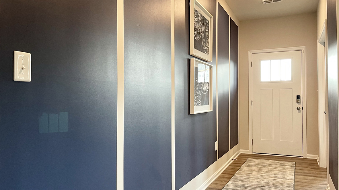 The distinct foyer leads you into a long hallway.