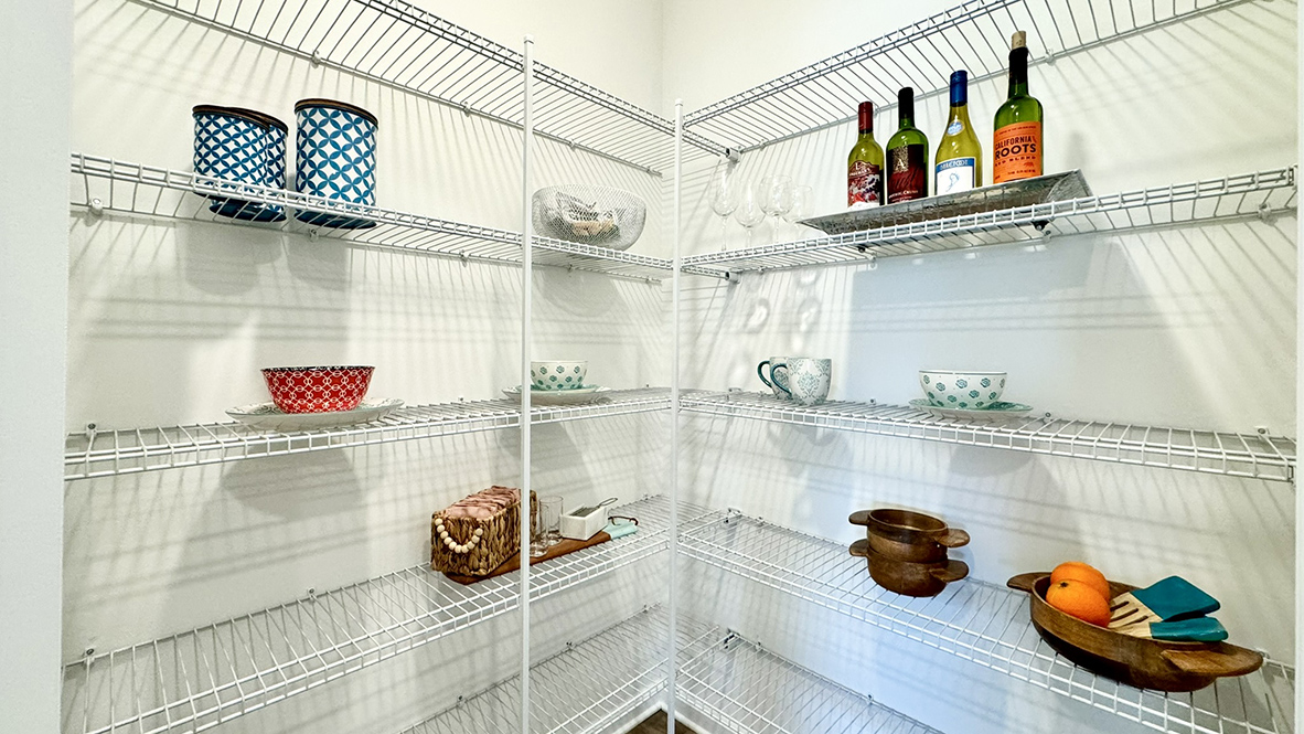 A large kitchen pantry is in the corner of the kitchen.