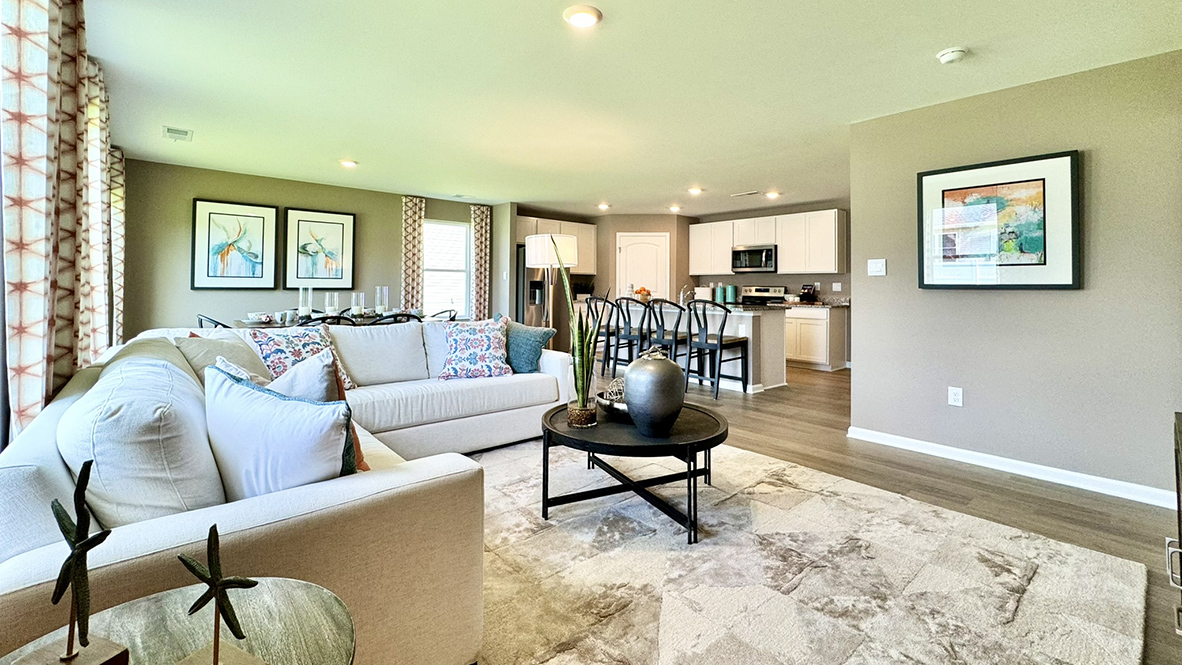 The home's open-concept kitchen, great room and dining area create the ideal space to relax or entertain loved ones.
