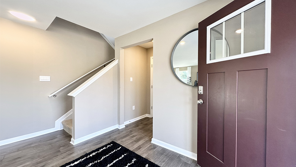 A welcoming foyer with a coat closet greets you as you enter your home from the cozy front porch.