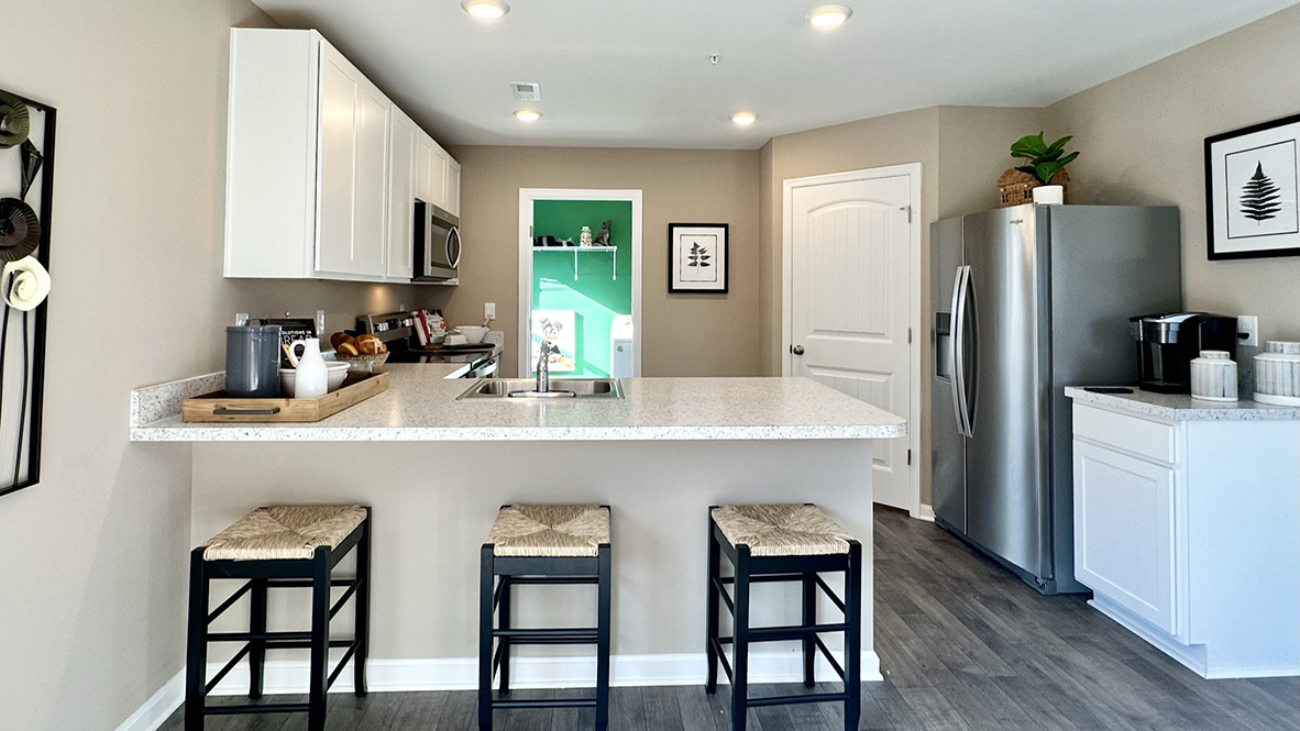 The family-friendly kitchen has a peninsula island with additional room for seating.