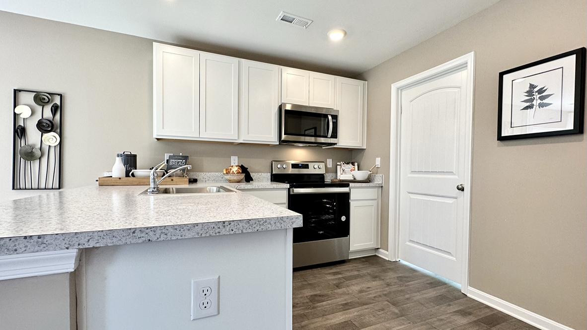 The family-friendly kitchen has stainless steel appliances.