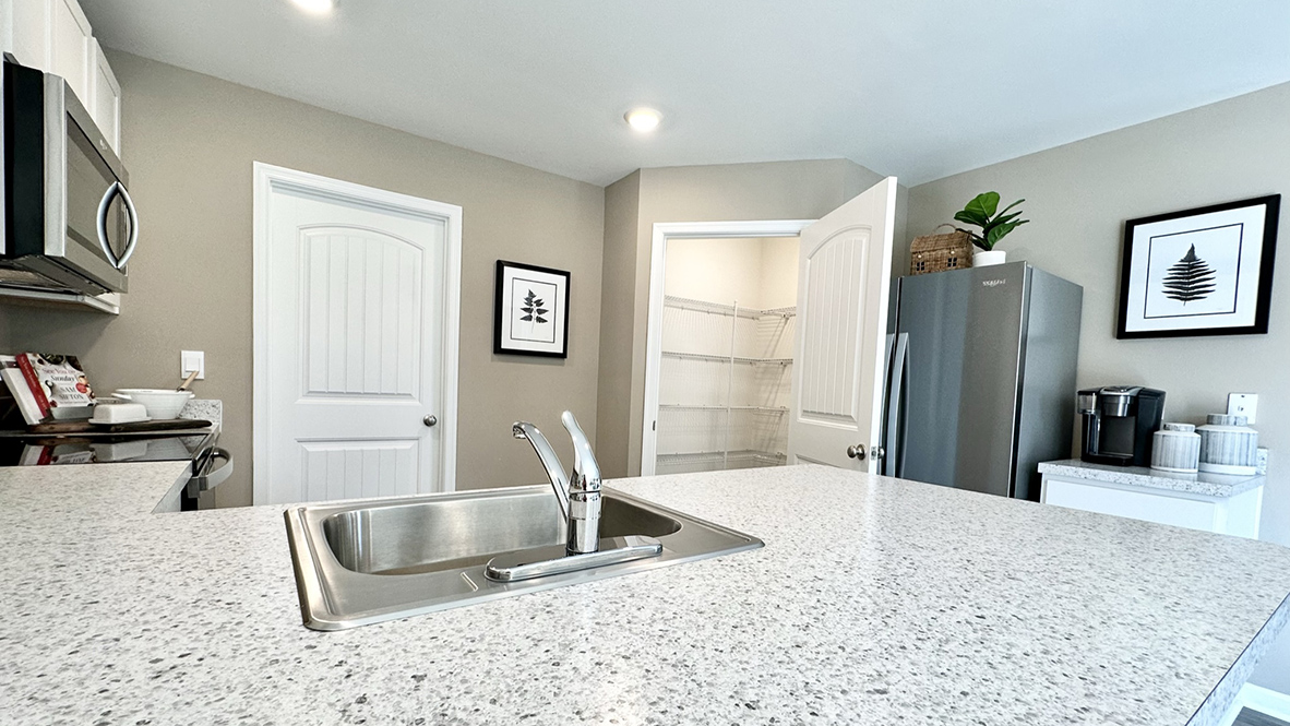 The family-friendly kitchen has granite countertops.