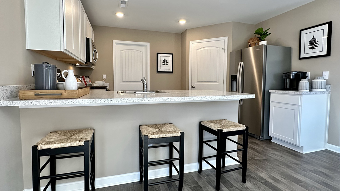 The family-friendly kitchen has a peninsula island with additional room for seating.