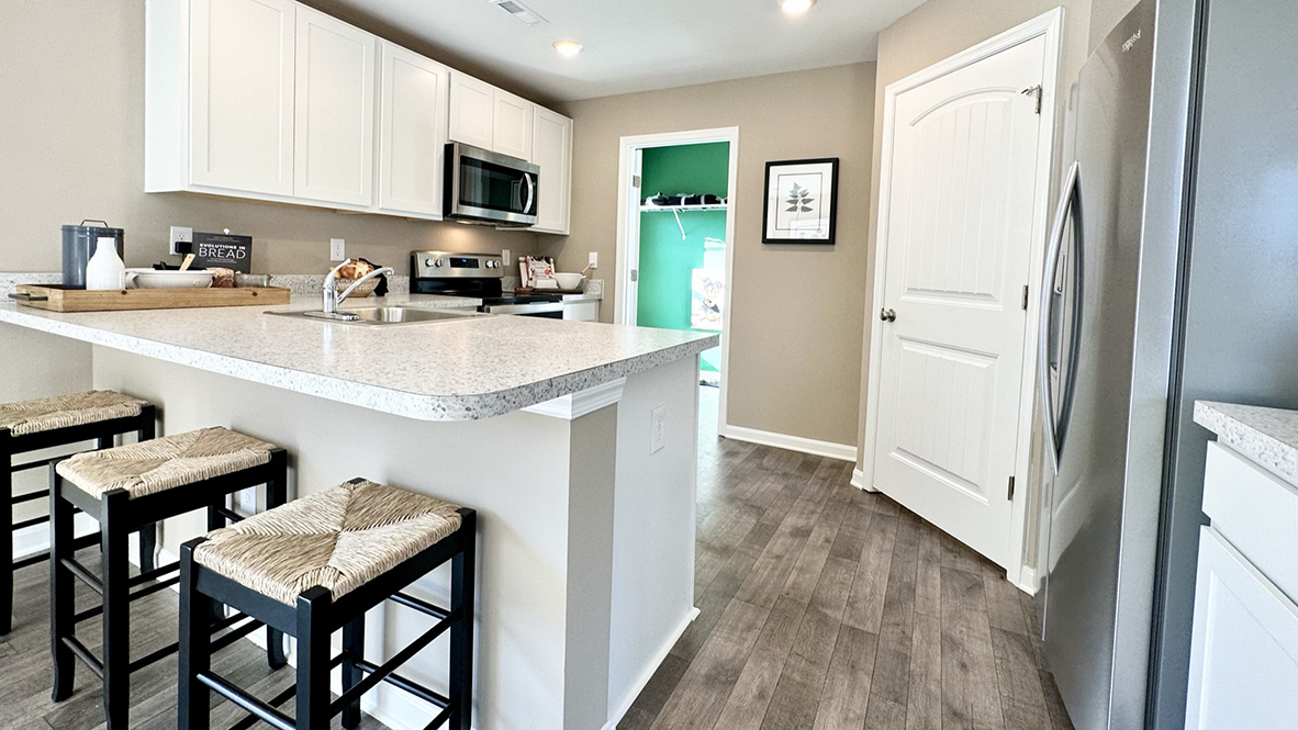 The family-friendly kitchen has a peninsula island with additional room for seating.