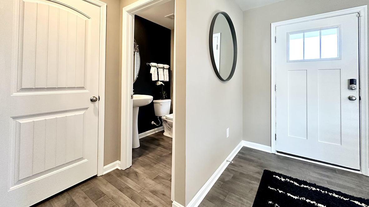 A welcoming foyer with a coat closet greets you as you enter your home from the cozy front porch.