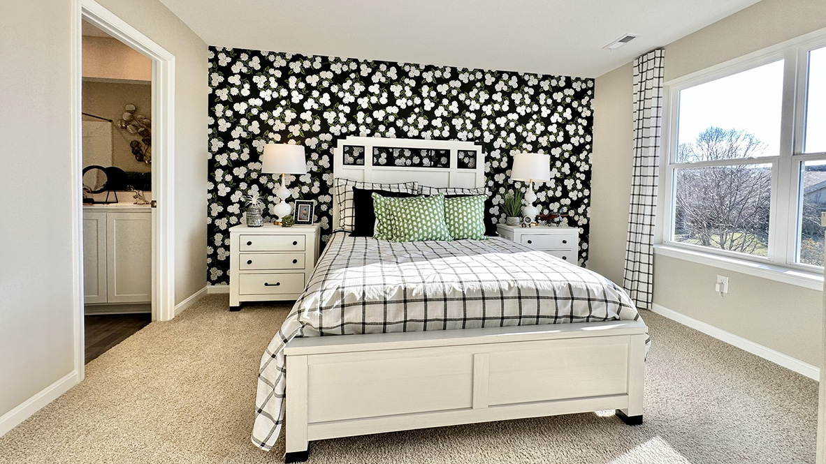 The upstairs owner's bedroom with an en suite bathroom and a walk-in closet sits in the back of the home for privacy.