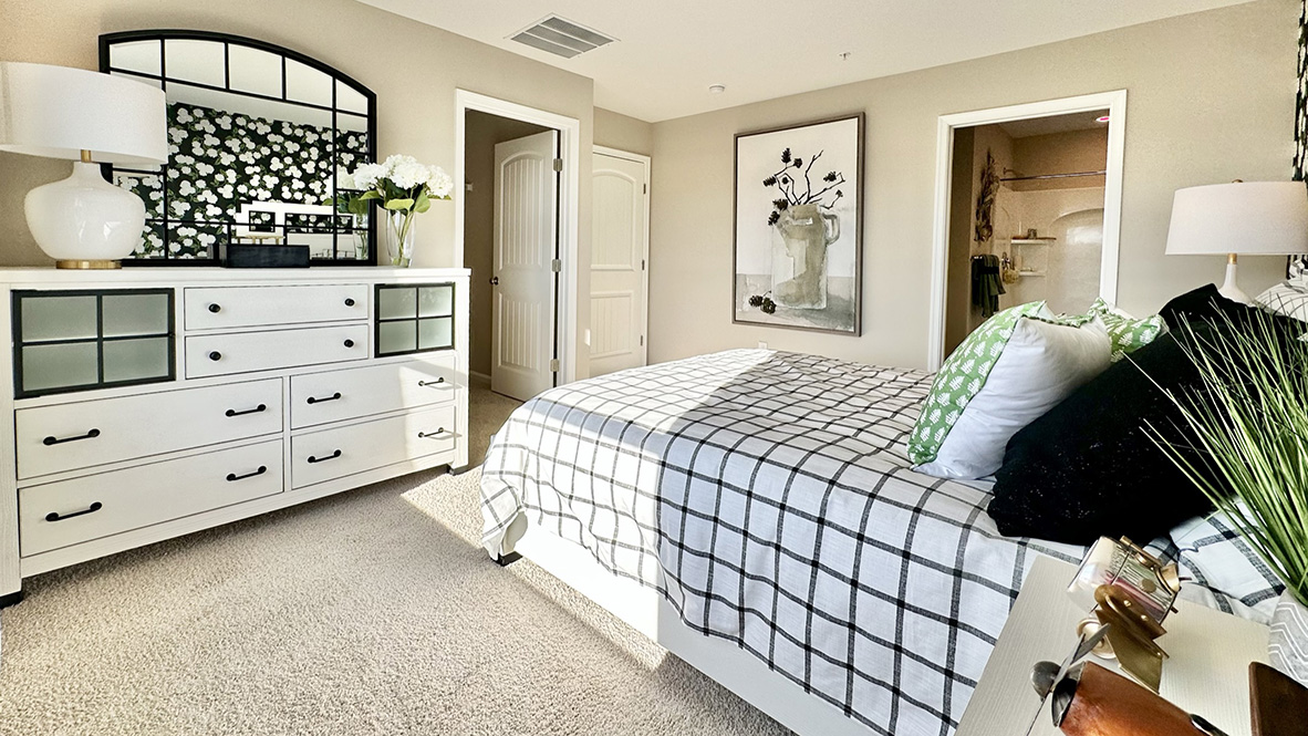 The upstairs owner's bedroom with an en suite bathroom and a walk-in closet sits in the back of the home for privacy.