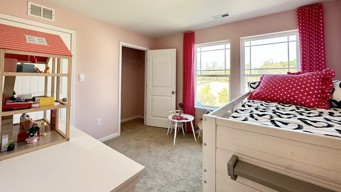 There are three additional bedrooms and a secondary bathroom on the second floor.