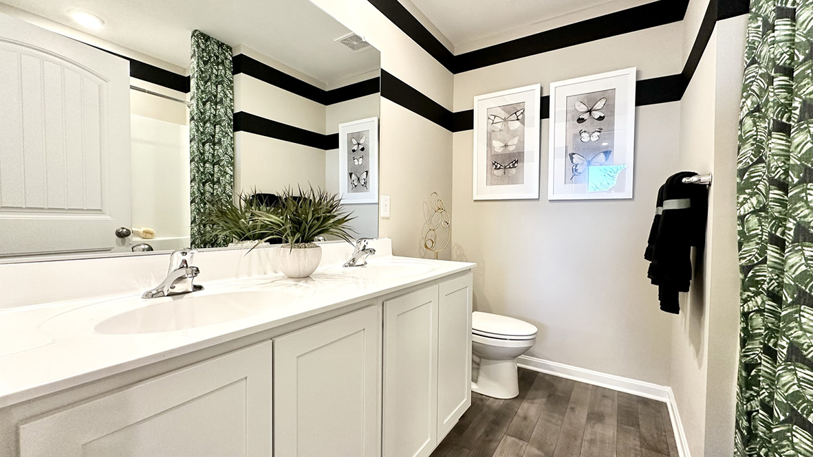 There are three additional bedrooms and a secondary bathroom on the second floor.