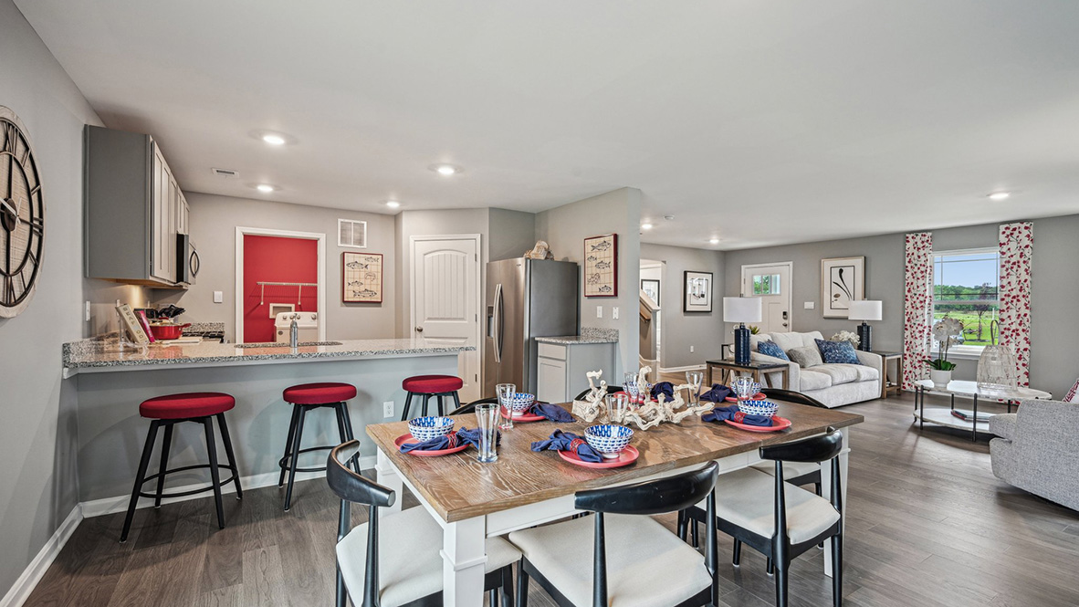 The family room is open to the dining space and the family-friendly kitchen.