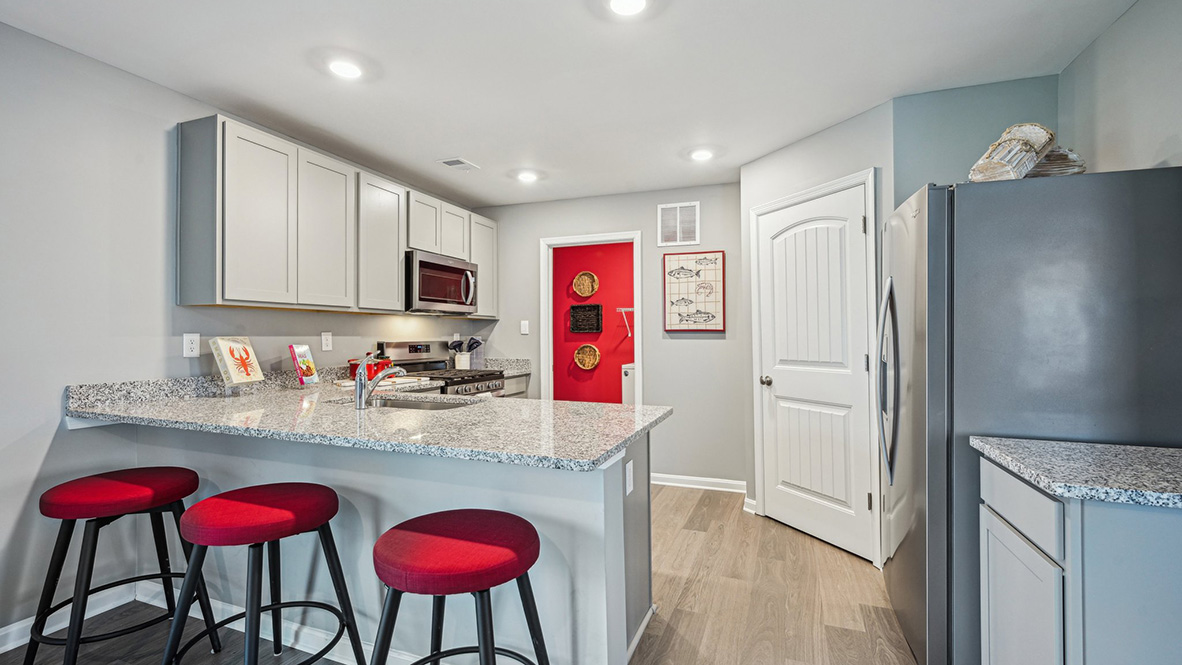 The family-friendly kitchen has a peninsula island with additional room for seating.