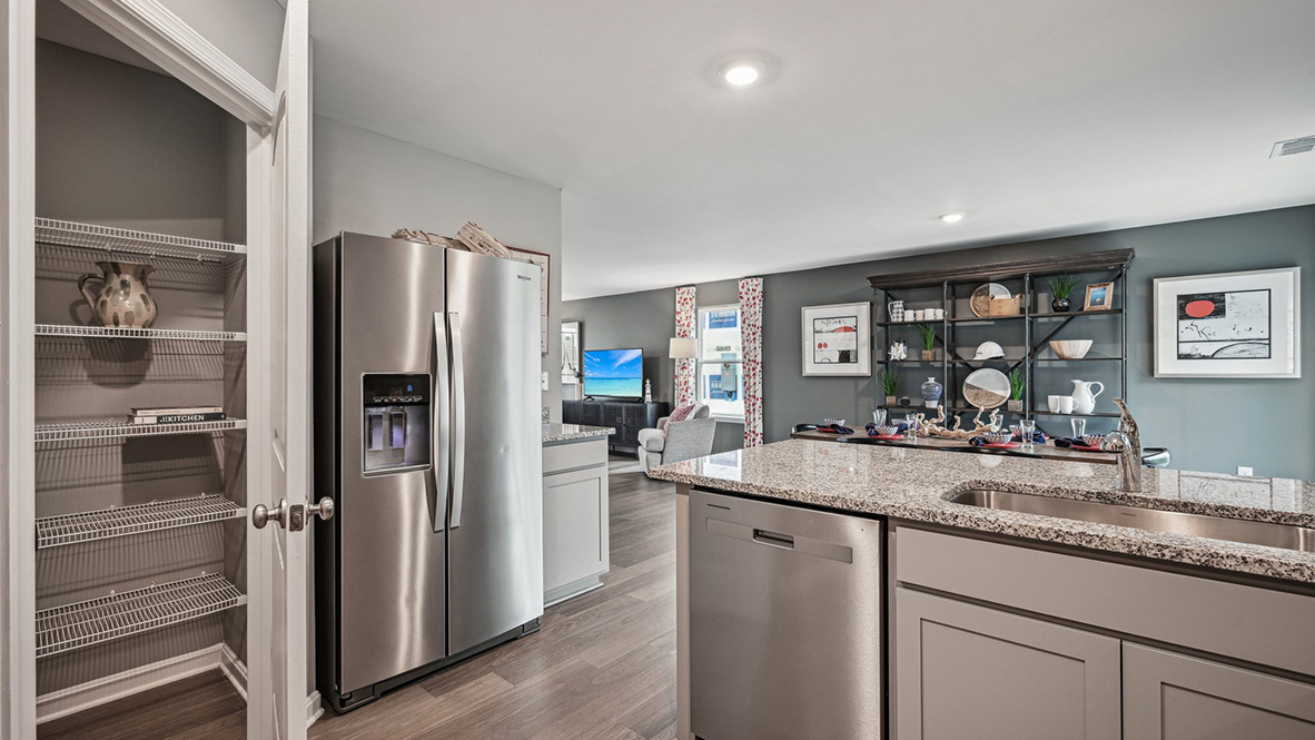 The kitchen has a large corner pantry.