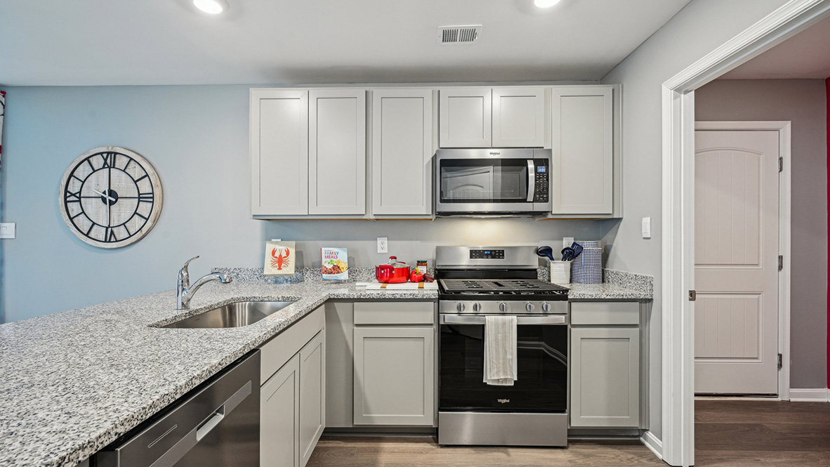 The family-friendly kitchen has granite countertops.