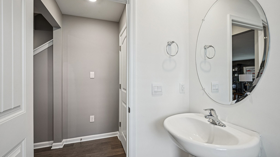 A powder room is conveniently located on the first floor tucked away in a private nook.