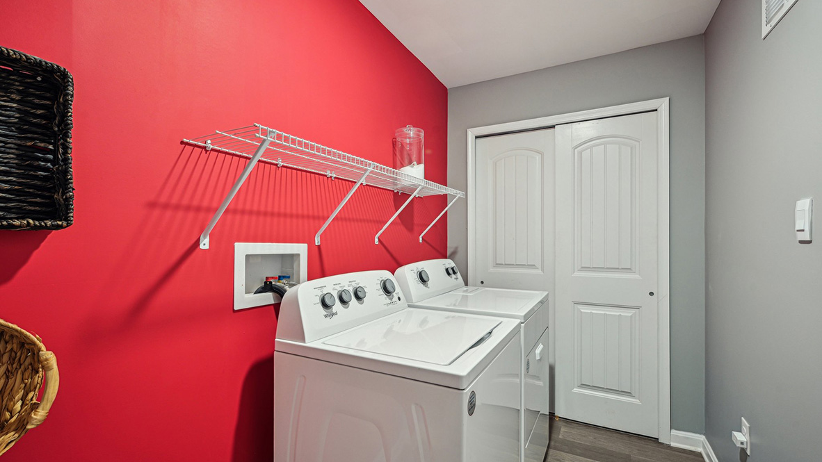 The convenient laundry room is located off the kitchen.