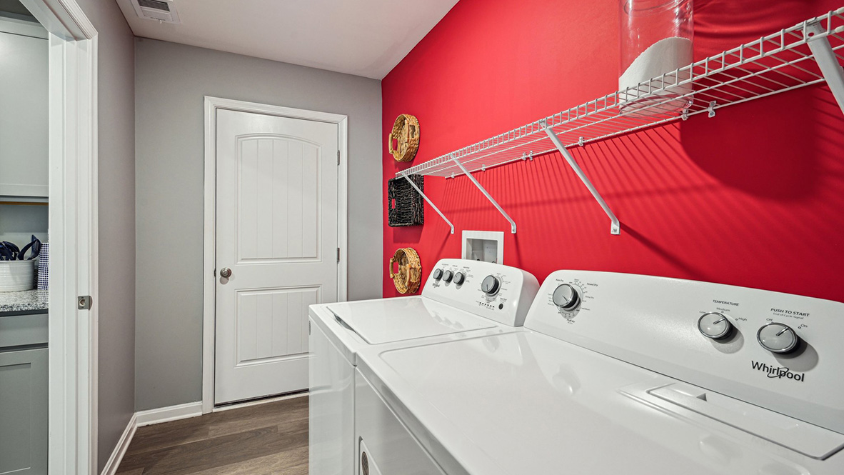 The convenient laundry room is located off the kitchen.