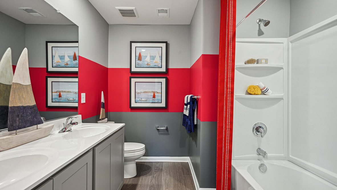 The third floor offers the fifth bedroom and a third full bathroom.