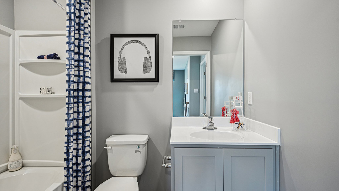 There are three additional bedrooms and a secondary bathroom on the second floor.