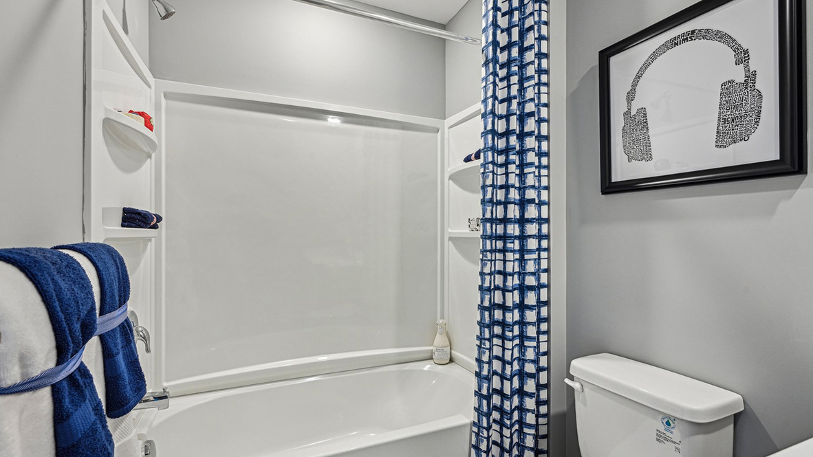 There are three additional bedrooms and a secondary bathroom on the second floor.