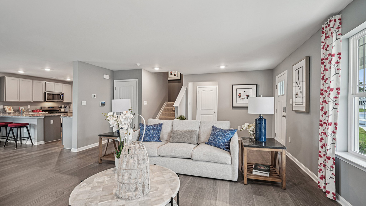 A coat closet is located next to the stairs.