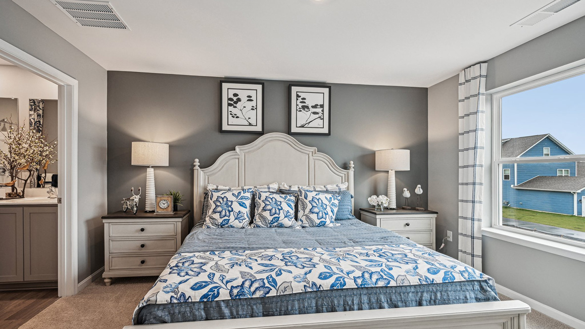 The upstairs owner's bedroom with an en suite bathroom and a walk-in closet sits in the back of the home for privacy.