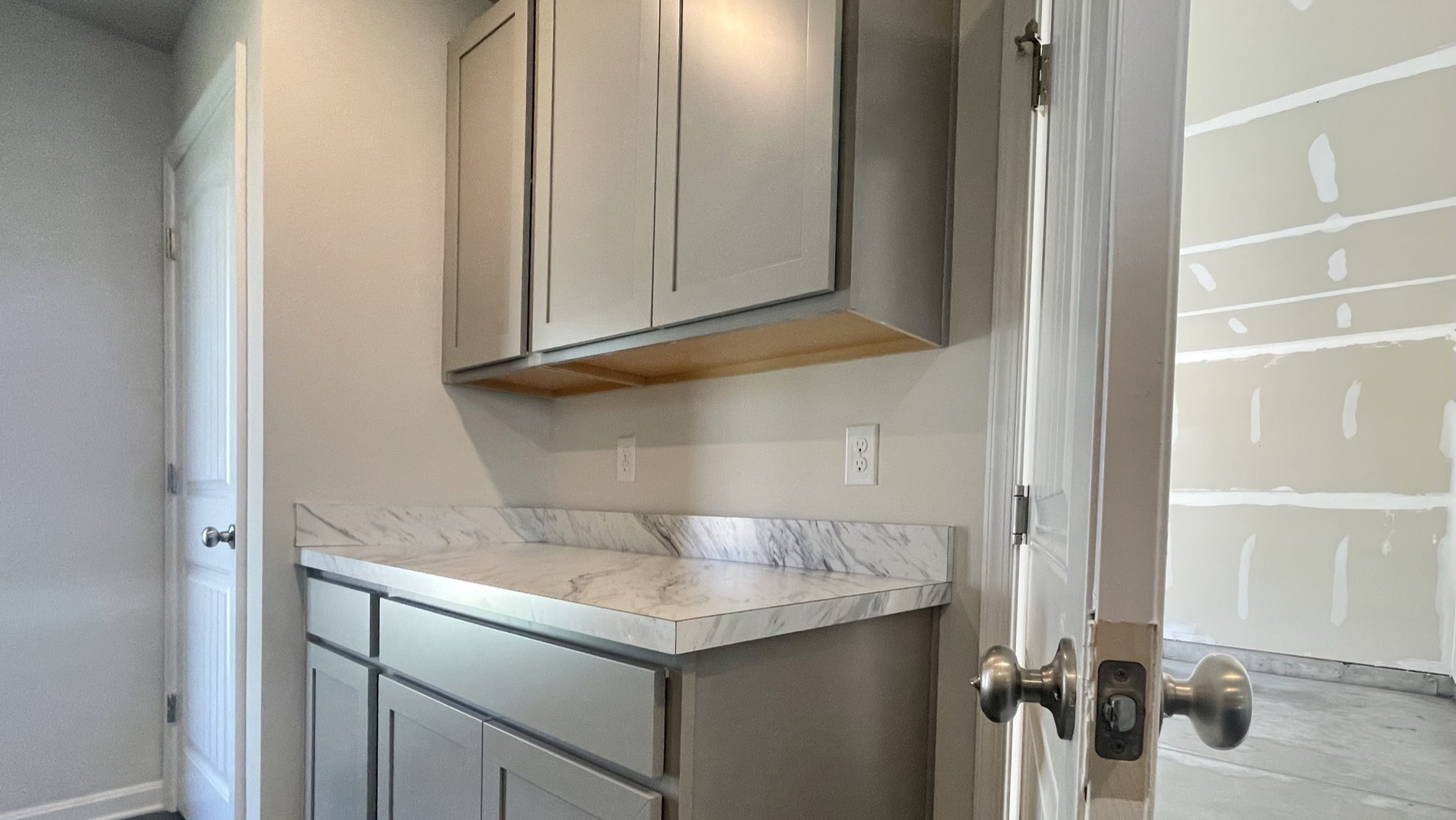 The two-car garage is located off the kitchen.