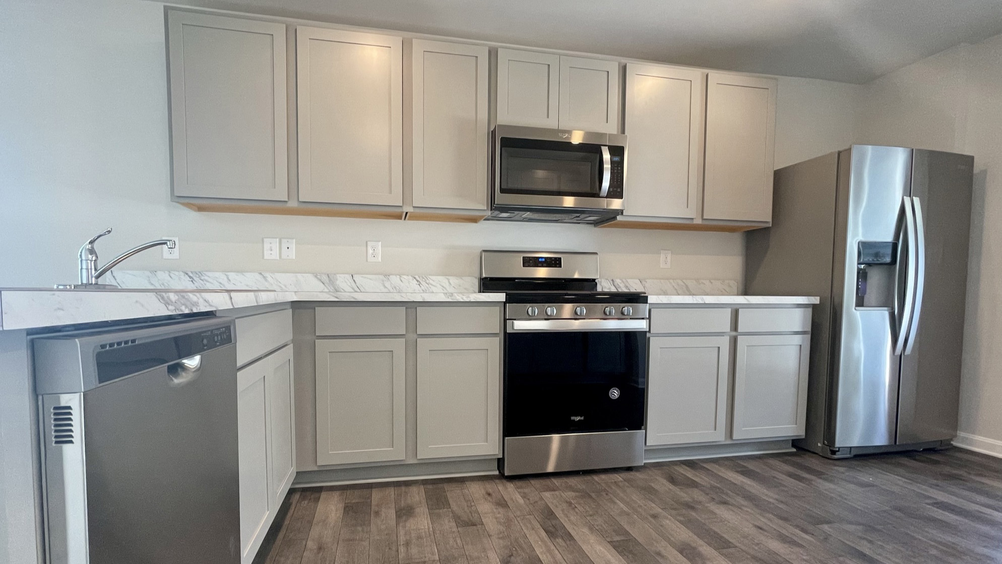 The well-appointed kitchen features granite countertops.