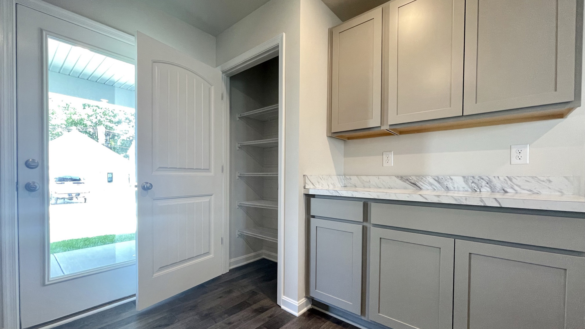 The well-appointed kitchen features a sizable pantry.