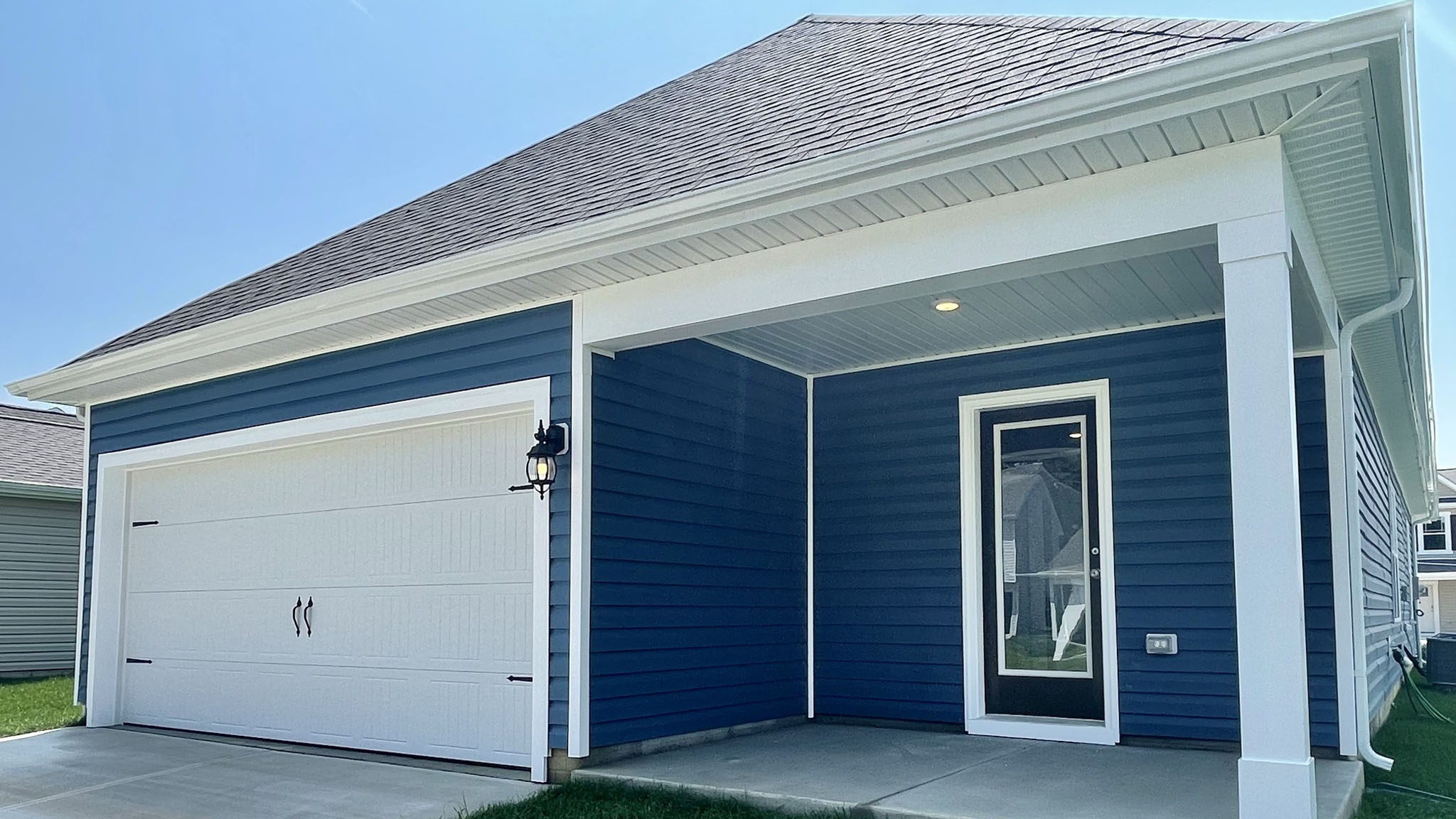 Leading out the back of the home through the kitchen is a cozy, covered patio.