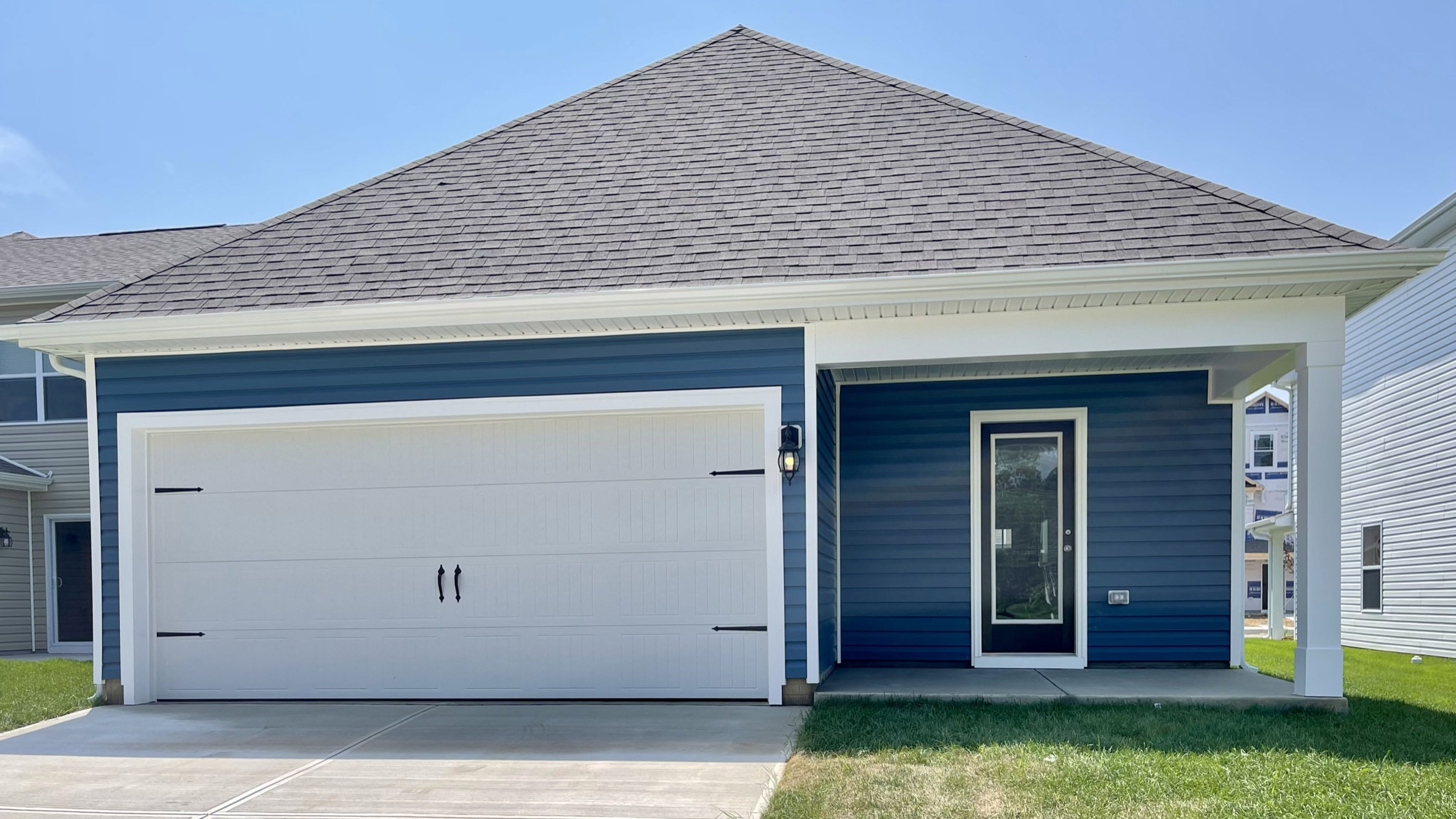 Leading out the back of the home through the kitchen is a cozy, covered patio.