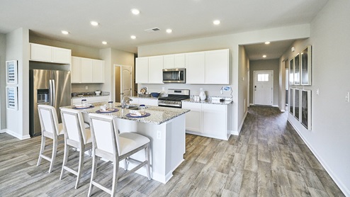 The home's well-designed kitchen features granite or quartz countertops.