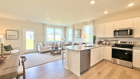 The kitchen is open to the ample living room and dining area.
